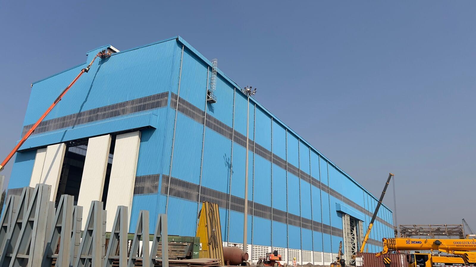 Architectural standing seam roofing for Lodha Mumbai: Premium metal building envelope featuring a minimalist aesthetic and hidden fastener technology by Rishonn & Reyansh.